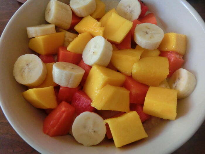 Fresh fruit salad with mango, papaya, and banana for breakfast in Chiang Mai, Thailand 