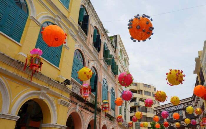 Macau: Is it Just for Gamblers? A Macau Travel Guide For Visitors Bright paper lanterns and colonial architecture in Senado Square, Macau.