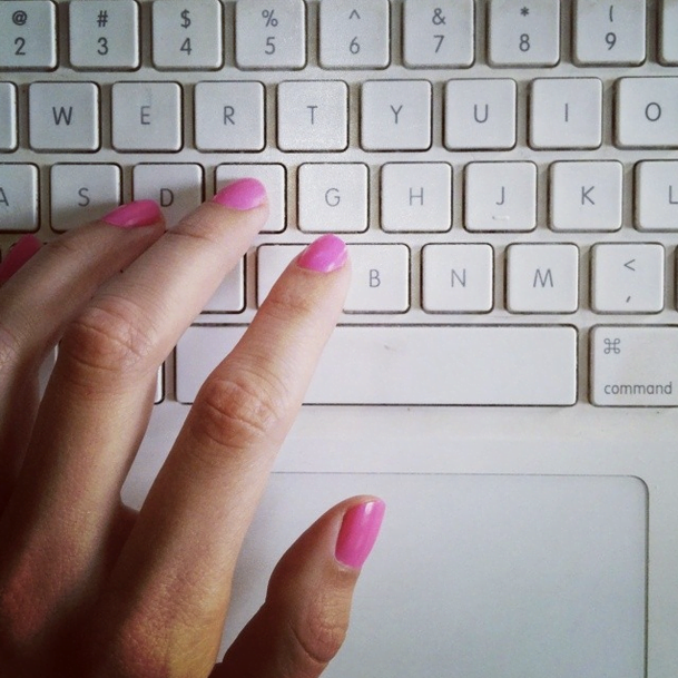 Why You DON'T need to start a blog to travel! Pink nails on computer