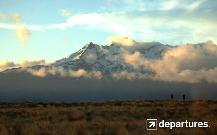 Departures scenery from New Zealand rugged mountains snowcapped peaks 