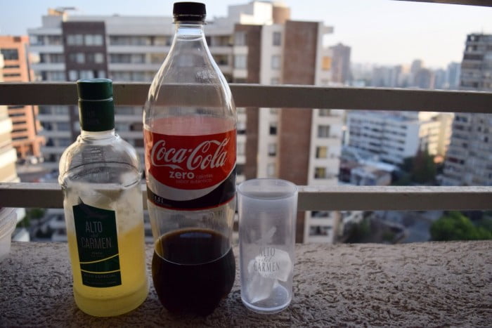 To make piscola you need pisco and Coca Cola in Chile