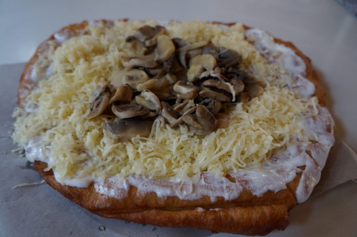 Langos is a fried dough and a traditional food to try in Hungary 