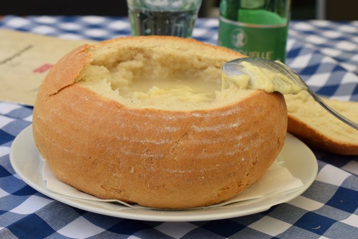 Trying Garlic soup in Bratislava