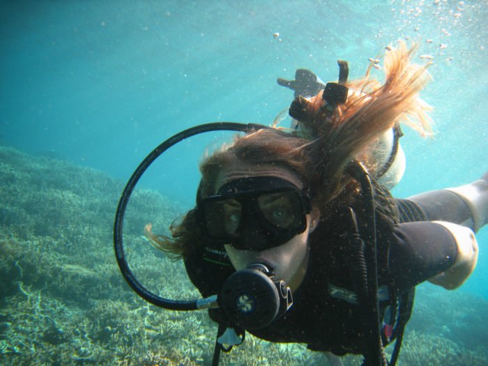13 Adventurous Scuba Diving Ladies Share Their Favorite Diving Destinations: Kristin of Camels and Chocolate diving in Sipadan, Borneo