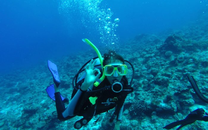 Kia of Atlas and Boots scuba diving in Daphne Island, Galapagos