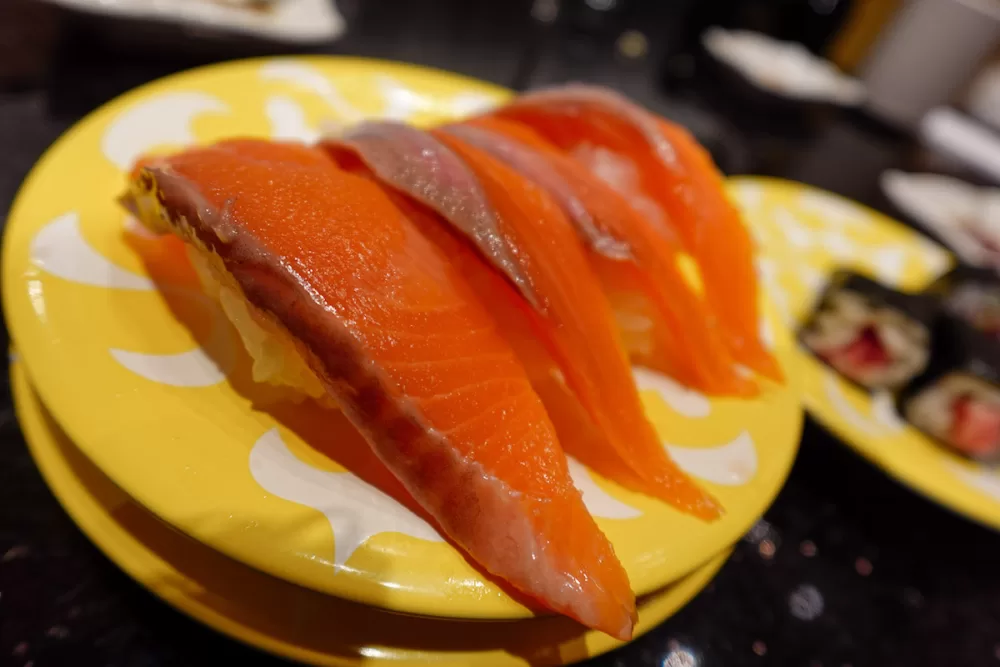 Plate with salmon sushi at a conveyer belt sushi restaurant in Hakodate 