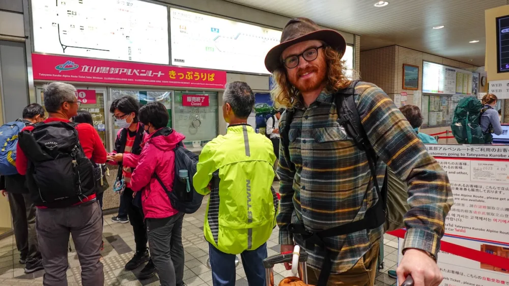At Dentetsu Toyama Station buying tickets for the Tateyama Kurobe Alpine Route 
