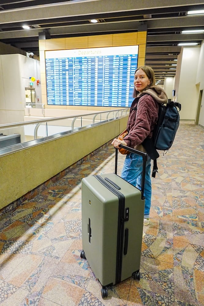 Audrey travelling with the Level8 Voyageur 28 Checked Luggage where 3 people packed 1 suitcase.