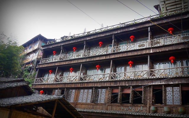 A building decorated with red lanterns in China with distinct character