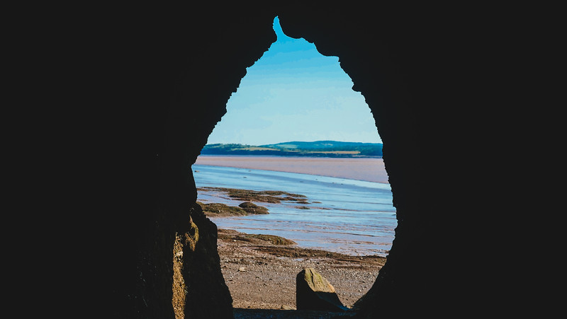 A cave in Hopewell Rocks with a unique shaped view in New Brunswick