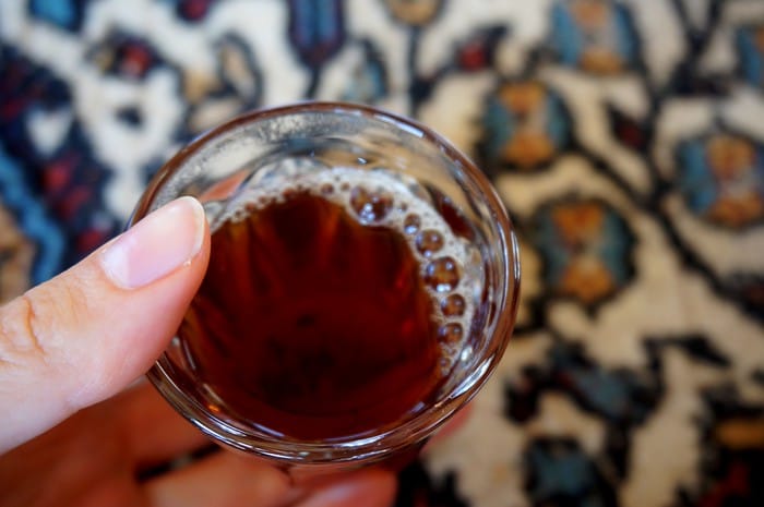 A cup of tea in a Bedouin tent in Jordan macro details from an overhead perspective