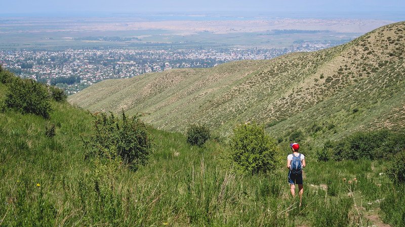 A day hike from Karakol with Eco Trek with That Backpacker Audrey Bergner enjoying views after putting in a great effort in Kyrgyzstan 
