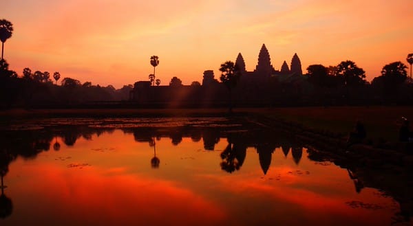 A fiery red and orange sunrise over a silhouette Angkor Wat, Cambodia
