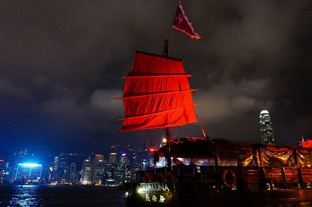 A Junk Boat Tour of Victoria Harbour Cruising Hong Kong At Night During A Symphony Of Lights! The Aqua Luna during our evening cruise of Victoria Harbour, Hong Kong.