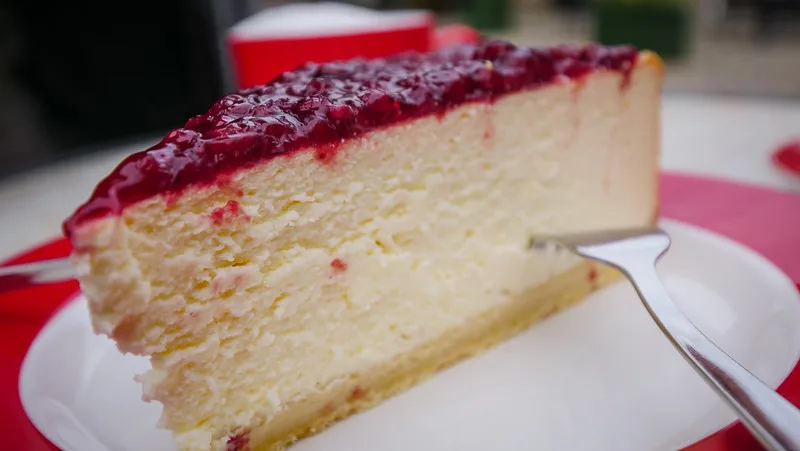 A most decadent slice of Cheesecake at Cafe Vincent macro details in Quedlinburg A most decadent slice of Cheesecake at Cafe Vincent macro details in Quedlinburg