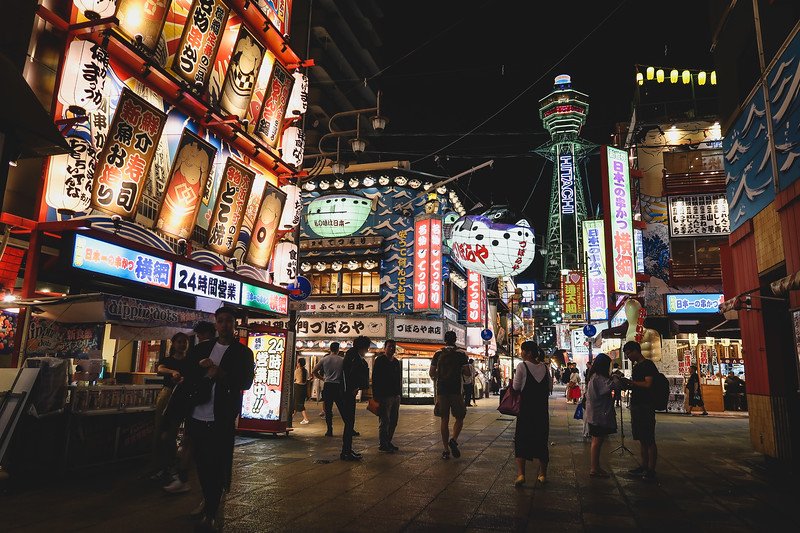 A must-do activity in Osaka is to visit Shinsekai at night with its bright lights and neon signs and retro style charm in Japan