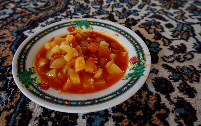 A potato, onion, and tomato dip we ate with pita for a meal inside the Bedouin tent in Jordan during our ecolodge travel adventure 
