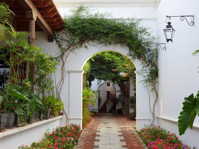 A relaxing weekend trip: a vineyard stay at Viñas Queirolo in Ica, Peru with archway and gardens views on the property 