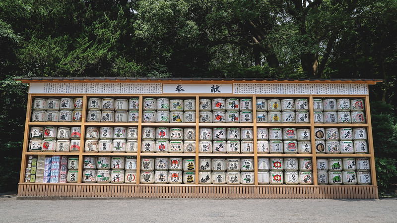A wall of sake offerings at Tsurugaoka Hachiman-gū in Kamakura in a beautiful display case that is symmetrical A wall of sake offerings at Tsurugaoka Hachiman-gū in Kamakura in a beautiful display case that is symmetrical