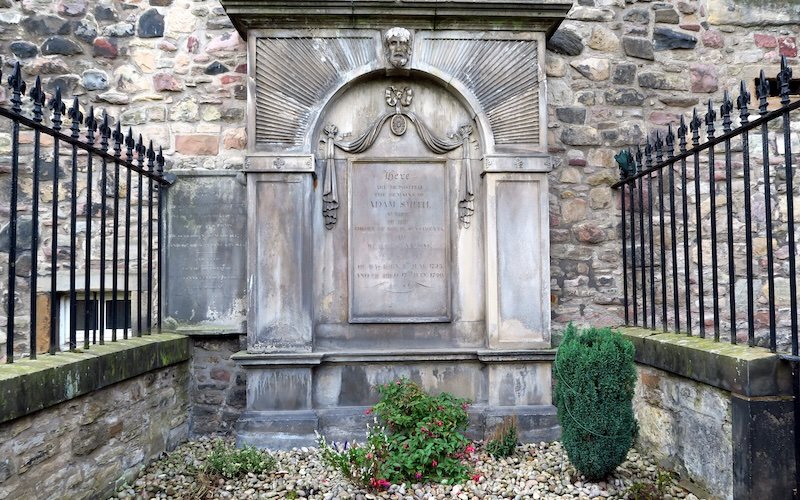 Grave of Adam Smith, father of modern economics, at Canongate Kirkyard on the Royal Mile in Edinburgh, Scotland during Eat Walk Edinburgh food tour