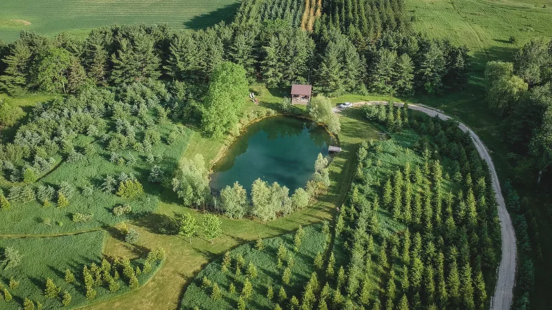 Aerial overhead views of our off-grid cabin with a private pond at Jecara Farms in Schomberg, Ontario Aerial overhead views of our off-grid cabin with a private pond at Jecara Farms in Schomberg, Ontario