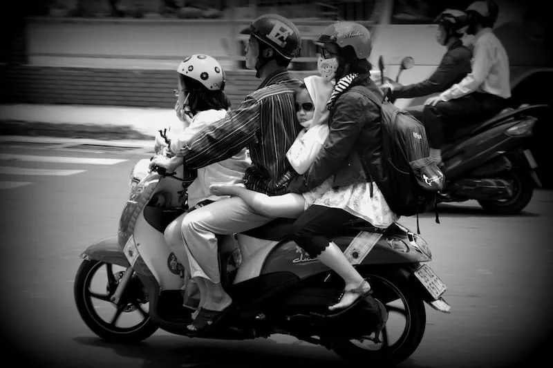 An entire family of four on a scooter in Ho Chi Minh City, Vietnam 