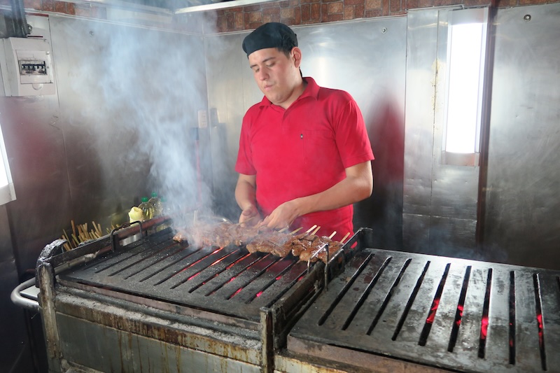 Anticuchos being prepared as a street food snack in Miraflores, Lima, Peru 