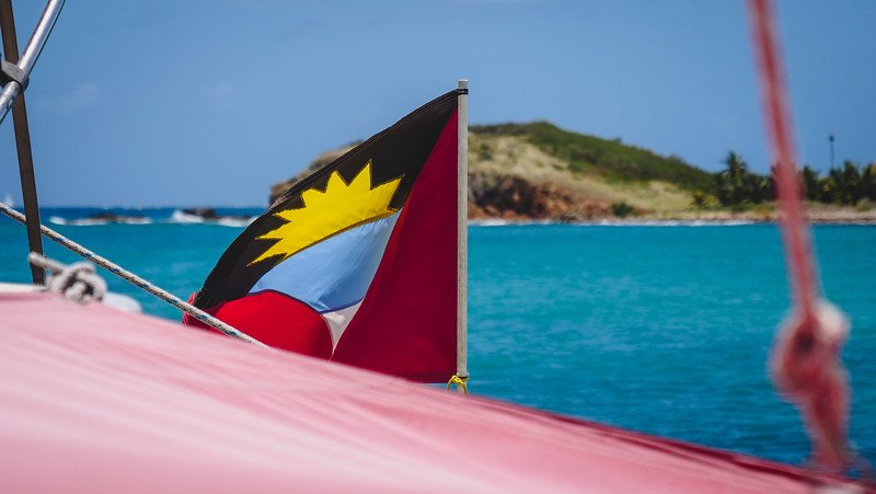 Antigua Flag flapping in the wind while on a sailboat Antigua Flag flapping in the wind while on a sailboat