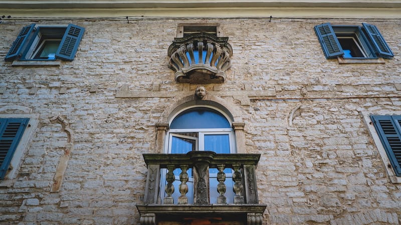 Architectural details in Pula with distinct balcony views from a ground level perspective in Croatia 