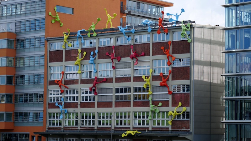 Art installations crawling all over a building in Dusseldorf, Germany 
