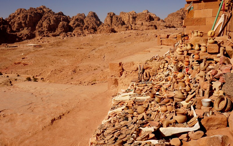 Artifacts found in Petra, Jordan all piled together and stored in one area with an incredible viewpoint showcasing the distinct geography