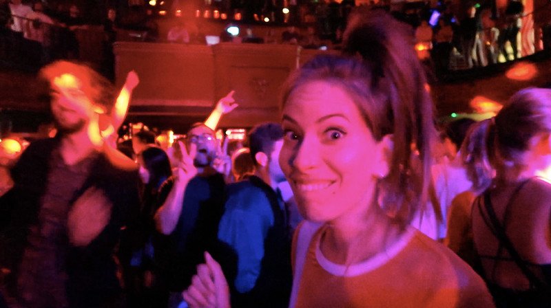 Audrey Bergner of That Backpacker dancing and smiling at KOKO London, surrounded by a lively crowd enjoying the vibrant nightlife and live music in Camden’s legendary concert venue, a hotspot for unforgettable nights out in the city