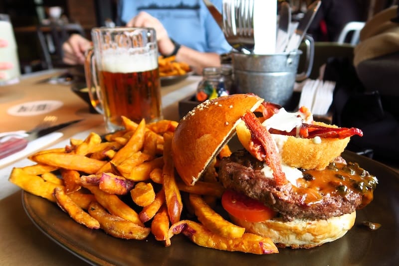 Avoid greasy gringo food like this massive burger we had in Cusco, Peru 