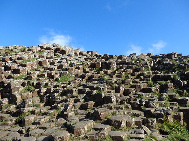 Basalt columns caused by volcanic activity in Northern Ireland is a once in a lifetime attraction worth seeing in person