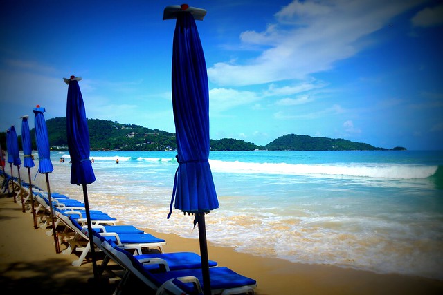 Beaches in Patong in Phuket lined with sun chairs in Thailand mere steps away from the water touching your toes 