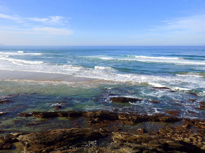 Beaches in Wilderness with waves crashing in along the rugged shore in South Africa 
