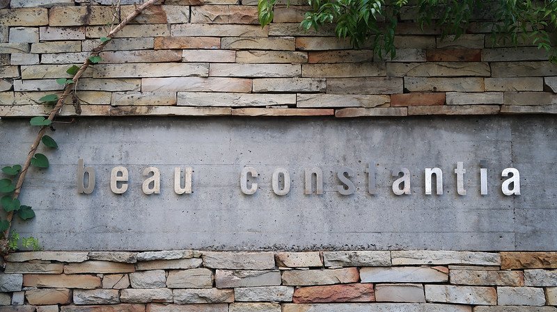 Entrance sign of Beau Constantia, a boutique wine estate in the Constantia wine region near Cape Town, South Africa, known for its hillside vineyards and wine tasting experiences
