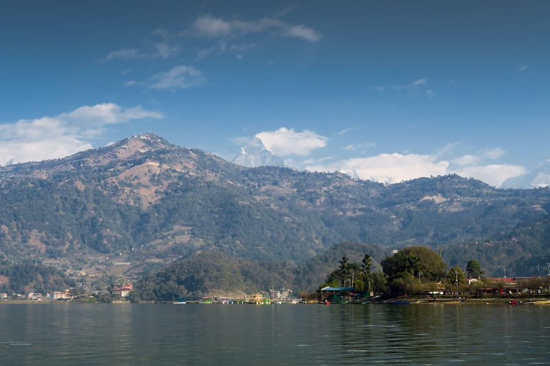 Beautiful views by the lake in Pokhara, Nepal with mountain background
