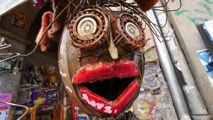 Berlin art installations street art in Germany with metallic face on display Berlin art installations street art in Germany with metallic face on display