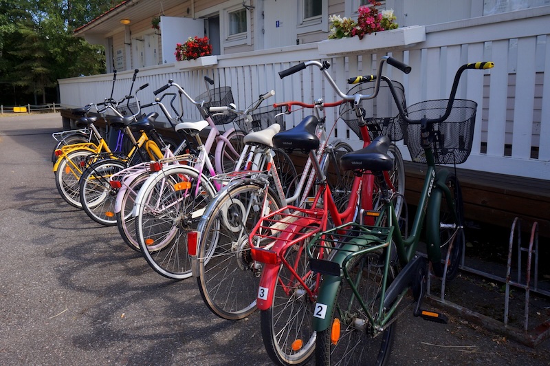 Bicycles with baskets parked in Hanko, Finland Bicycles with baskets parked in Hanko, Finland