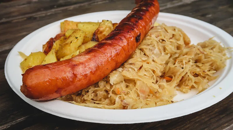 Bigos and Kielbasa macro details of the Polish food at Malbork Castle served on plate in Poland