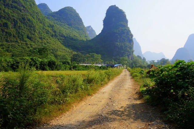 Bike ride in the countryside of Yangshuo with rural roads and karst mountain views in China