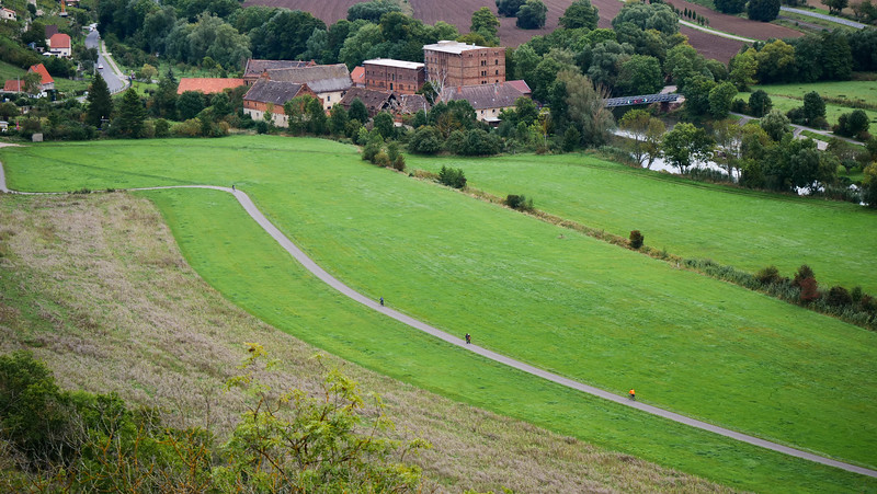 Biking trails for a wine trip across Saale-Unstrut, Germany with bicycles plying the small path that crosses the town and farmland 