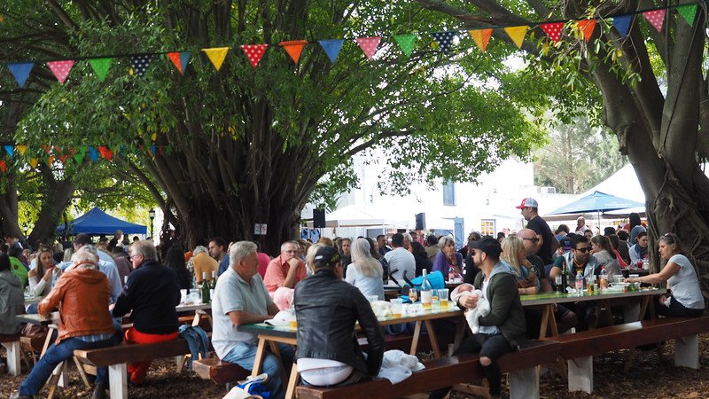 Blaauwklippen Family Market in Stellenbosch, South Africa with outdoor dining and tables filled to the brim at full capacity 