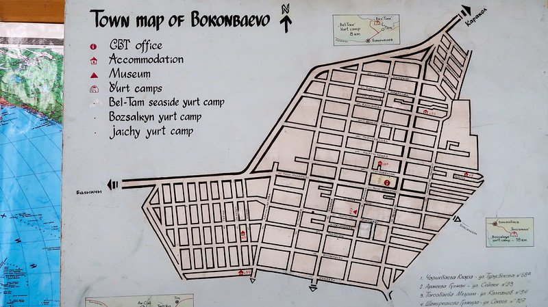 A detailed town map of Bokonbayevo, Kyrgyzstan, showing streets, the CBT Bokonbayevo office, accommodations, museums, and nearby yurt camps marked with icons