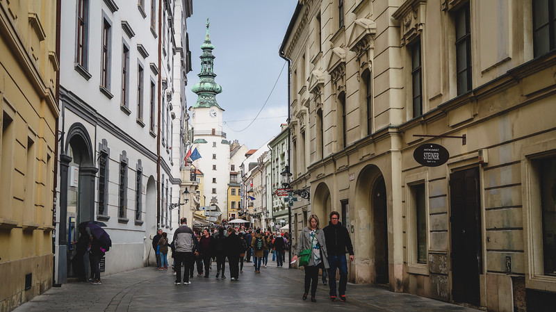 Bratislava Old Town and Michael’s Gate in the distance with pedestrians in Slovakia Bratislava Old Town and Michael’s Gate in the distance with pedestrians in Slovakia