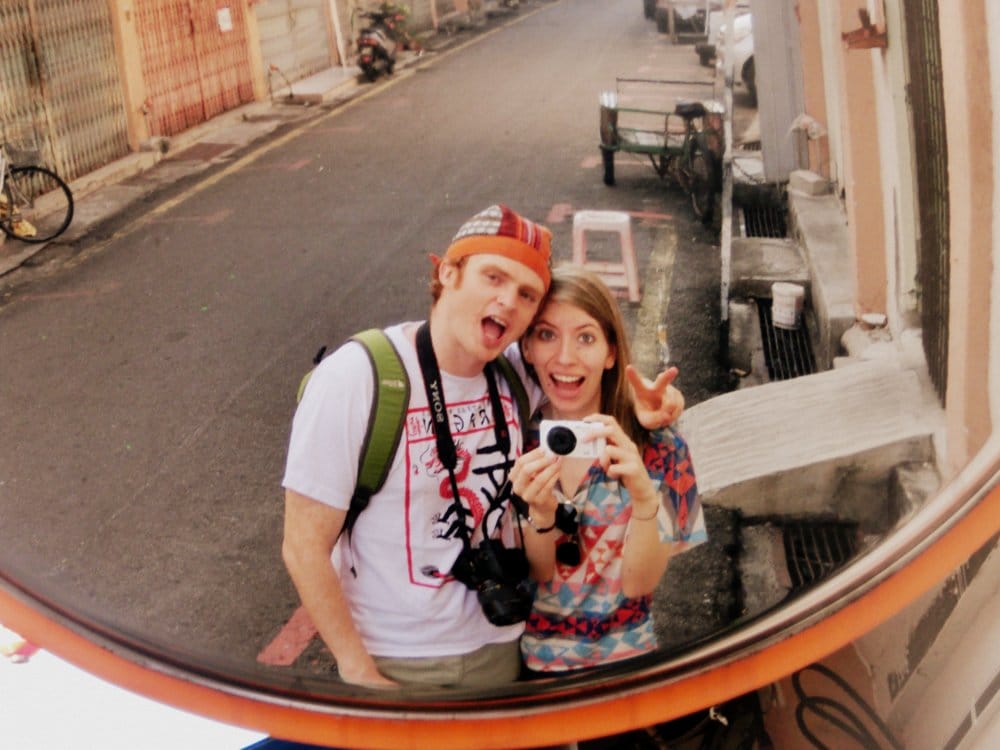 Budgeting As A Couple: Sharing Expenses When You Travel: That Backpacker Audrey Bergner and Nomadic Samuel traveling together in Melaka, Malaysia