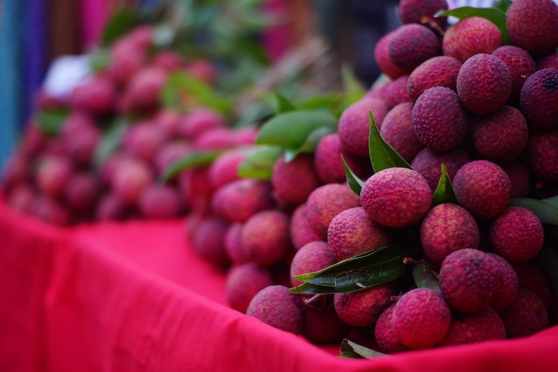 Bunch of lychee a subtropical fruit native to SE Asia and China for sale at the Chiang Mai Saturday Night Market in Thailand 
