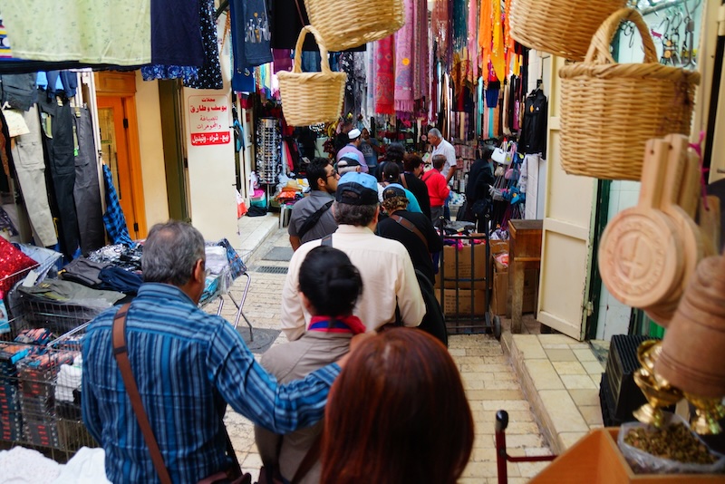 Bustling market scene in Nazareth, Israel with shops and shoppers galore Bustling market scene in Nazareth, Israel with shops and shoppers galore