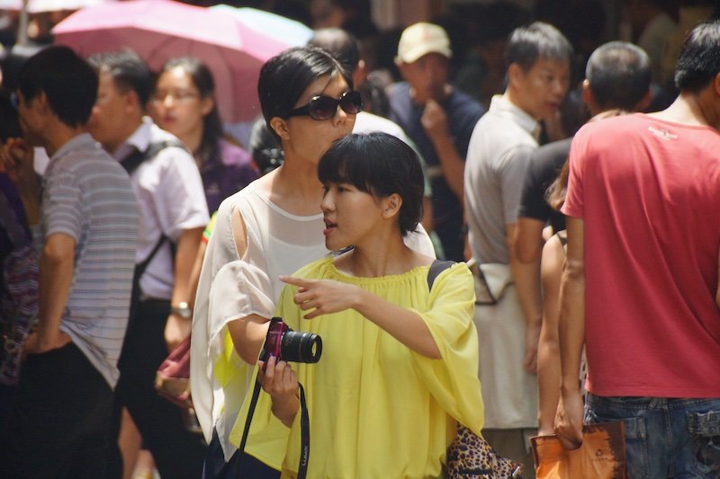 Bustling street scene in Macau sea of pedestrians Bustling street scene in Macau sea of pedestrians